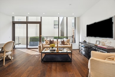 The room is well-lit with both recessed lighting &