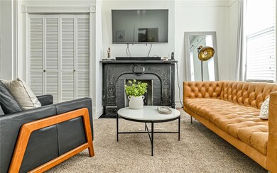 The Living Room with decorative marble fireplace.