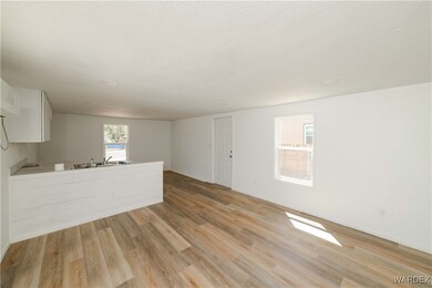 Unfurnished living room with a textured ceiling an