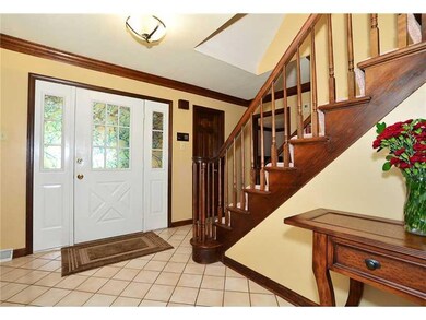 Entry/Foyer. Open entry in earth tones and rich wo