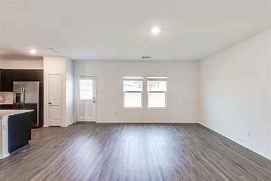 Unfurnished living room with dark wood finished f