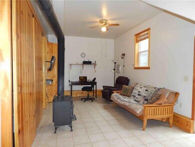 Off entryway is lower level sitting...