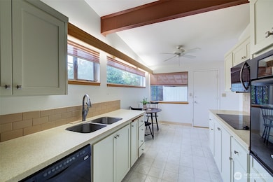 When you first walk into the entry the kitchen is on your left.