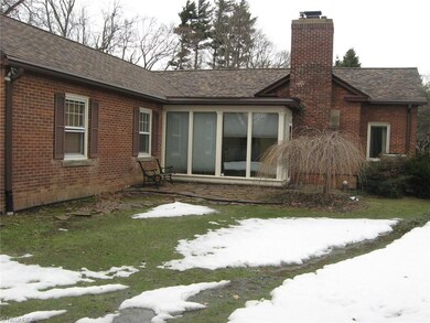 SUNROOM is heated and leads to Stone Patio