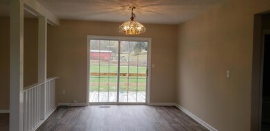 Large Dining Room Area for entertaining leads to Side Deck. 