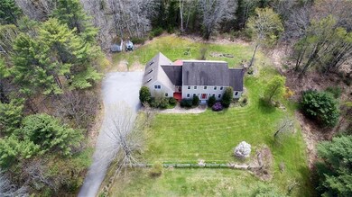 Aerial shows the private yard, 3 car...