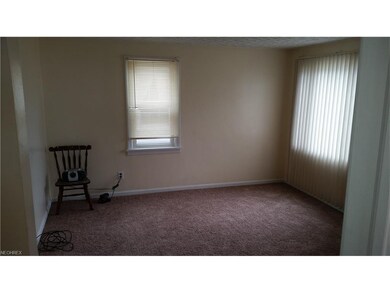 Living room with new carpet, paint & newer windows