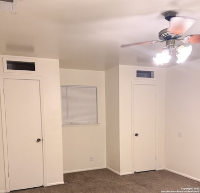 Primary bedroom with 3 closets.
