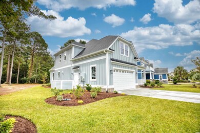 Exterior space with a garage and a front lawn