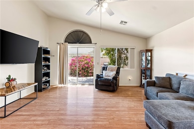 Living area featuring light wood-style floors, cei