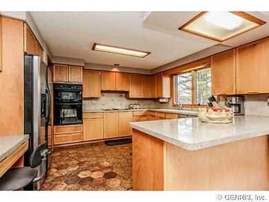 Kitchen. Overhead lighting provides a well lit wor