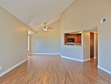 The living room is spacious, open and boasts vault