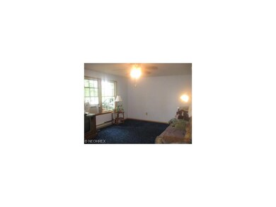 Nice size living room with ceiling fan