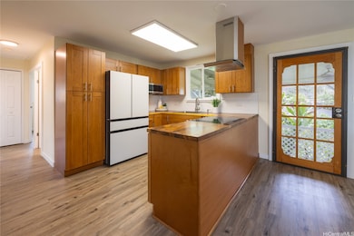 The heart of the home - a custom kitchen - features Acacia wood countertops.