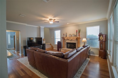 Living area with wood finished floors, visible ve