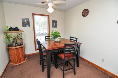 A large dining area opens to the living room, perf