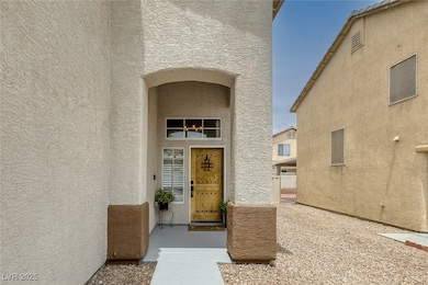 Doorway to property featuring stucco siding