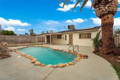 View of pool featuring a patio area and a fenced backyard