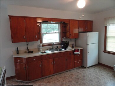 Large eat in kitchen with appliances and new flooring.