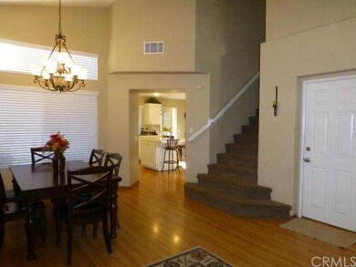 Formal dining area and view into the kitchen. Noti