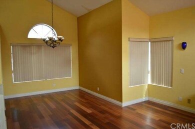 Hardwood flooring in living room and dining room.