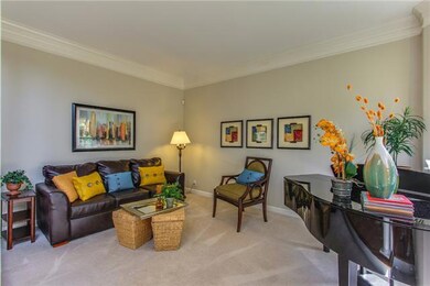Bay window, crown molding and columns in this open welcoming room!