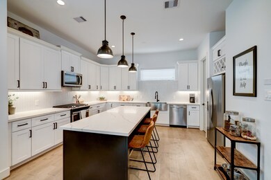 The kitchen is a DREAM! Large center island with b