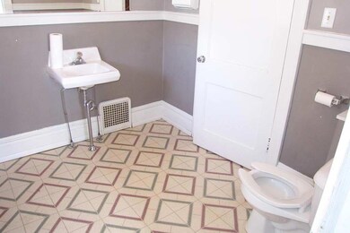 Main floor room with hardwood floors.