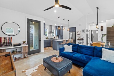 Living area with stairway, visible vents, concret