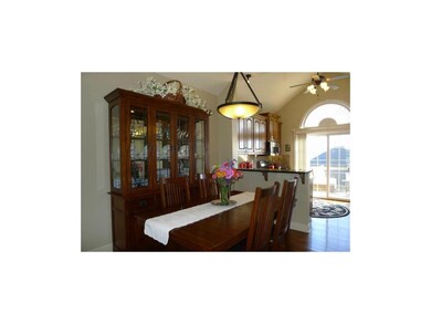 DINING AREA PLUS GRANITE BREAKFAST BAR FOR GATHERI