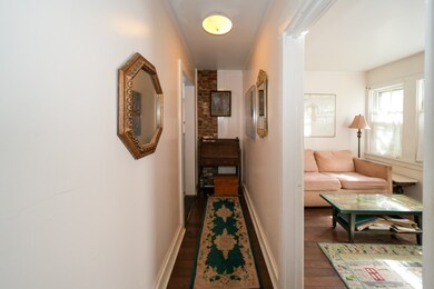 Hallway to guest bedroom being used as a den living area