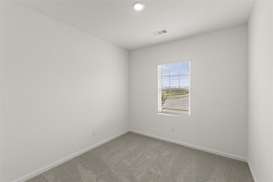 Spare room featuring carpet