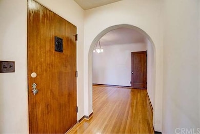 Original front entry door with curved walked into 