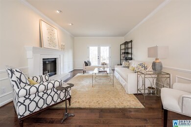 Hardwood floors highlight this beautiful room and 