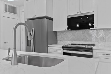 Kitchen featuring appliances with stainless steel
