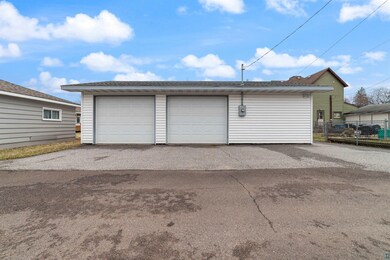 Detached garage featuring fence