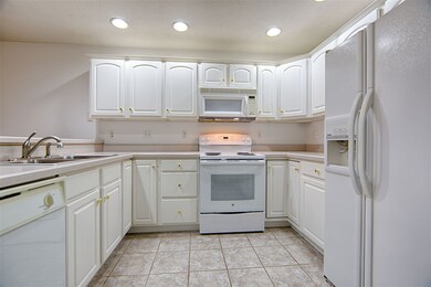 Plenty of kitchen cabinetry and workspace