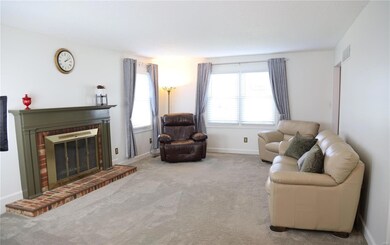 Large living room with fireplace is ready for your