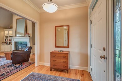 Spacious foyer features the hardwood floors which 