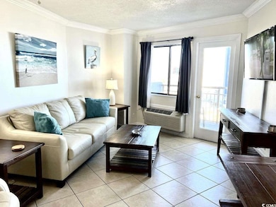 Tiled living room with a textured ceiling and orna