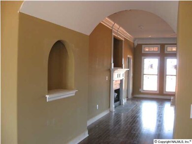 Art niche in hall and archway leading to Great Room