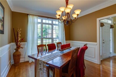Light-filled dining room shows off the gleaming hardwoods found on the main level!