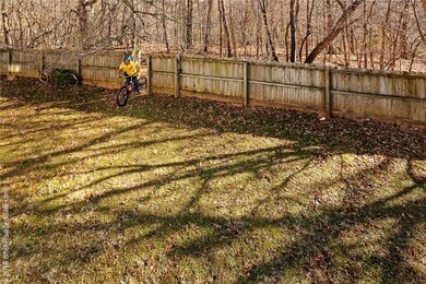 Huge fenced yard backs up to the slaughter pen bike trails