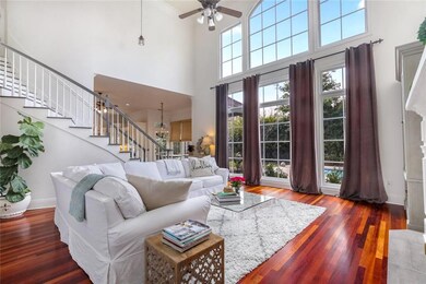 View of living area with wall of windows overlooki