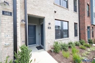 Property entrance with brick siding