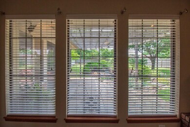 A great view of the pergola-covered patio from the