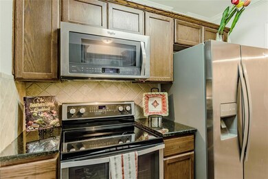 Stainless Whirlpool appliances and fridge conveys