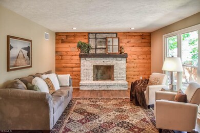 Beautiful family room boasting a brick fireplace w