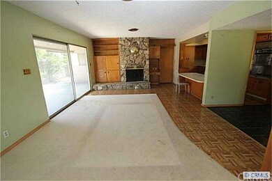 Living room with rock fireplace and lots closet sp