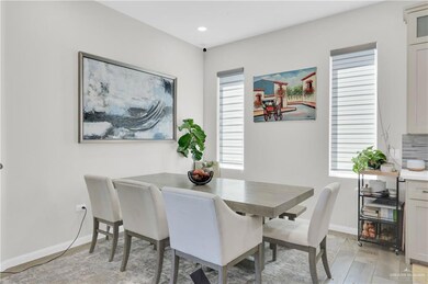 Dining area featuring light wood-style flooring and recessed lighting